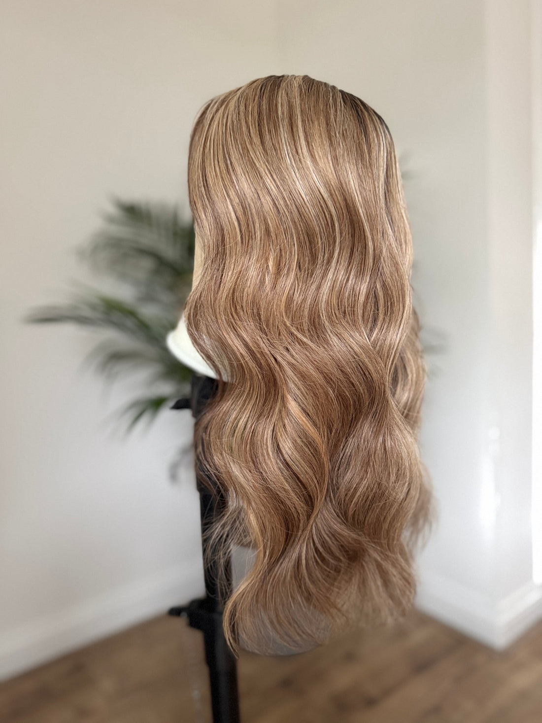 Dimensional brunette human hair wig with softly blended blonde balayage highlights