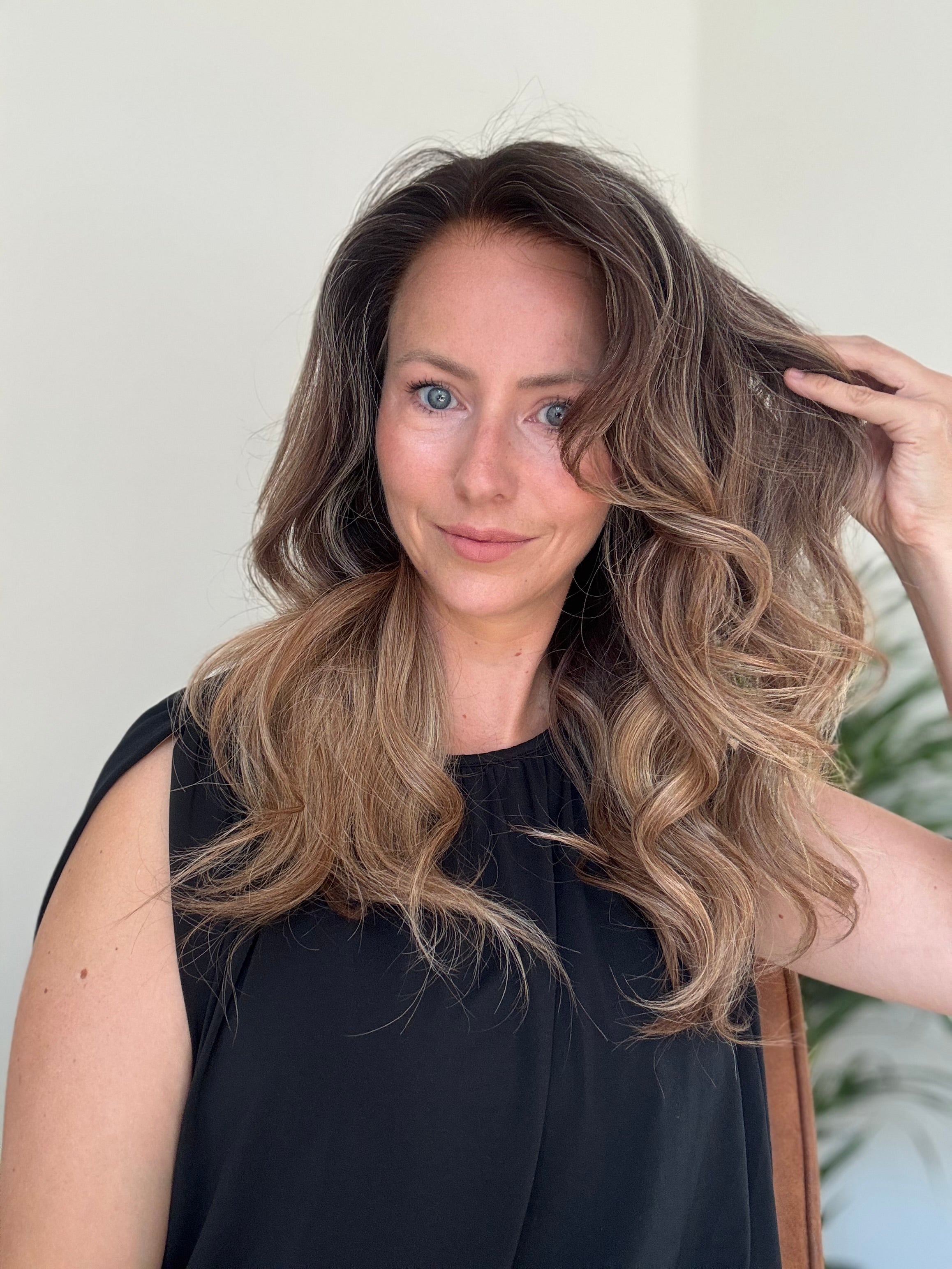 Olivia human hair wig styled with soft voluminous curls