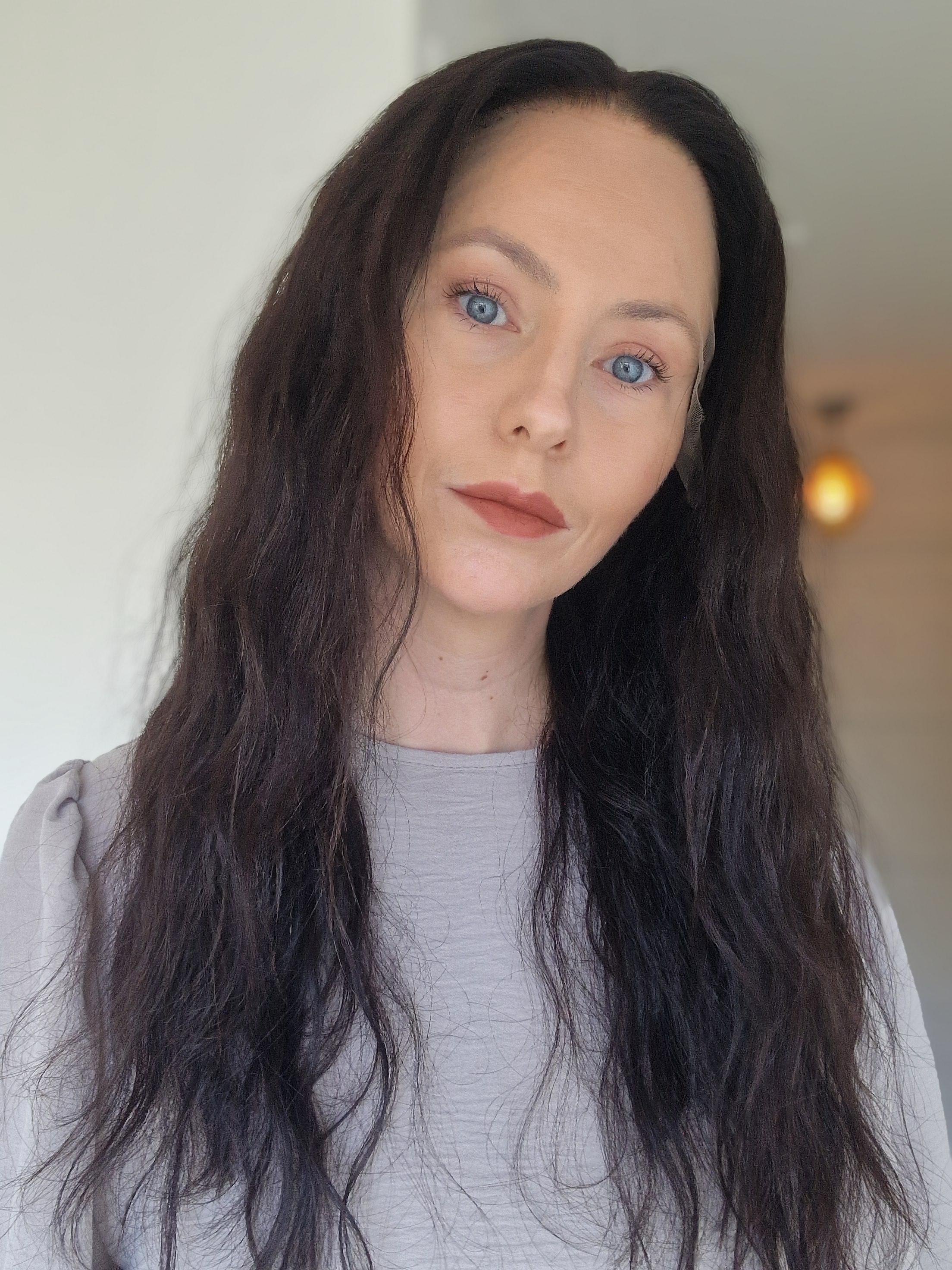 Natural black curly HD lace human hair wig by Uncommon Wigs