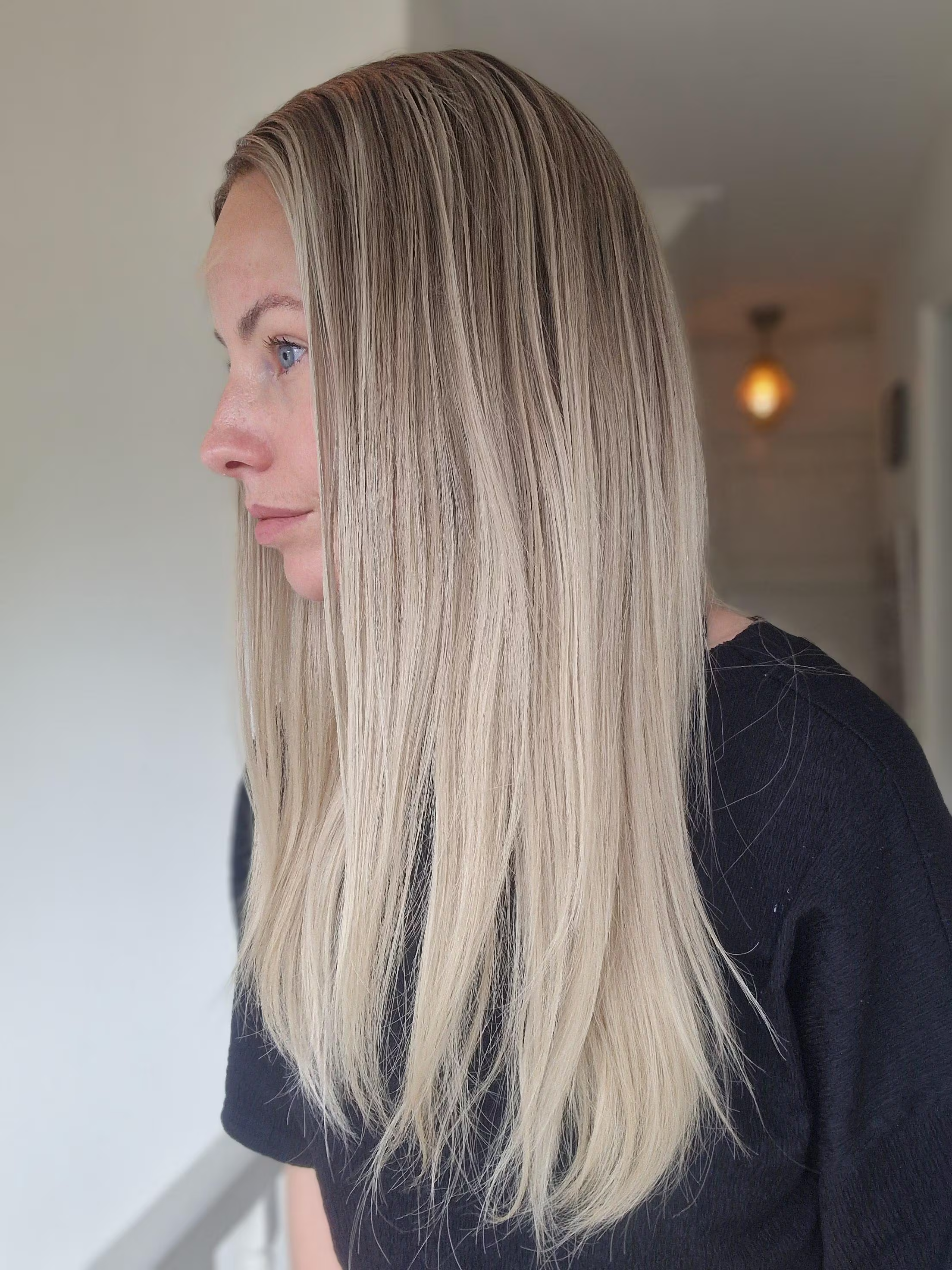 Close-up of the ash blonde rooted blend on The Lisa Wig