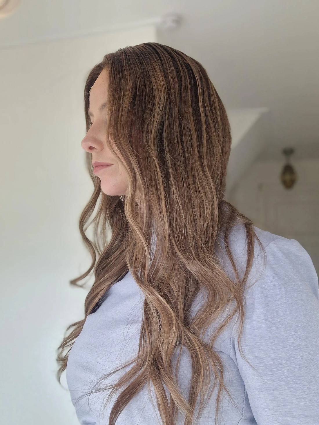 The Hailey Wig featuring a light brown balayage blend and natural movement